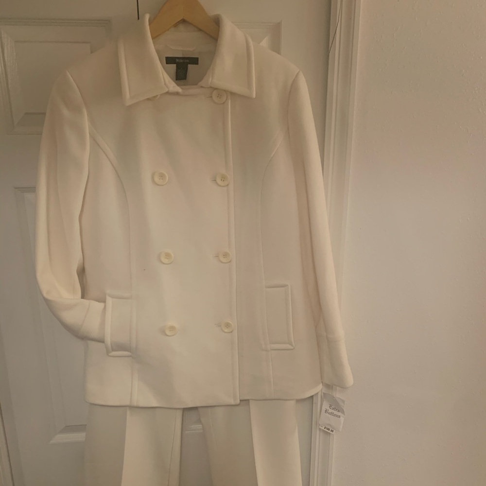 women’s cream coat and slacks